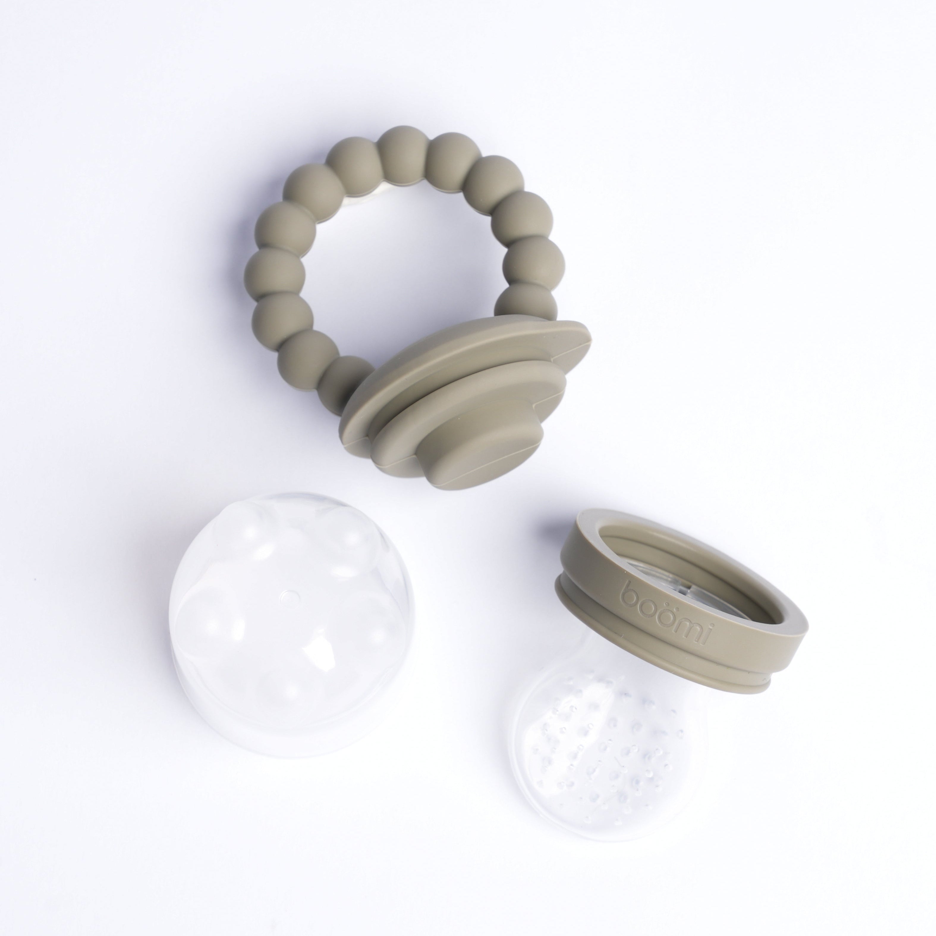 Beige baby teething ring with clear silicone disc on a white background