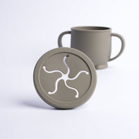 Green mug with matching lid on a white background