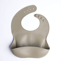 Beige silicone bib on a white background